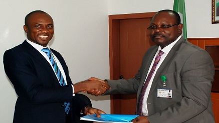 (L-r): Godbless Safugha, executive secretary, Association of Non-Bank Micro Finance Institutions of Nigeria (ANMFIN), and Bar. Chris Onyemenam,  director general, National Identity Management Commission (NIMC) in a warm handshake shortly after signing the Memorandum of Understanding (MOU) on the enrolment of 6 million ANMFIN members into the National Identity Database (NIBD) at the NIMC HQ, Abuja… recently.